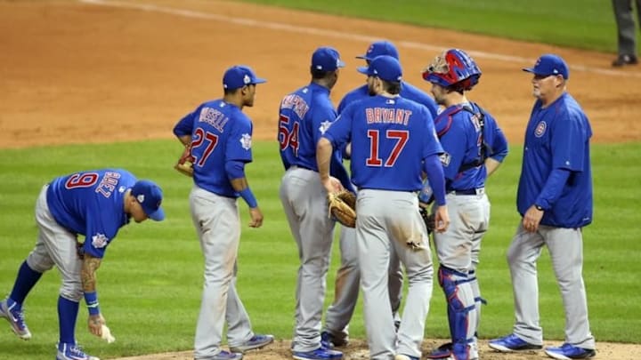 Nov 2, 2016; Cleveland, OH, USA; Chicago Cubs relief pitcher Aroldis Chapman (54) talks with pitching coach Chris Bosio (right) in the 8th inning against the Cleveland Indians in game seven of the 2016 World Series at Progressive Field. Mandatory Credit: Charles LeClaire-USA TODAY Sports