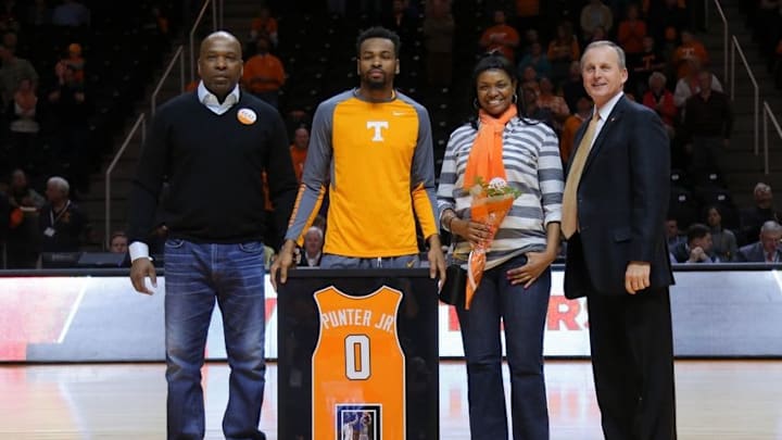 Mar 5, 2016; Knoxville, TN, USA; Tennessee Volunteers head coach Rick Barnes poses with guard Kevin Punter (0) and family on senior day before the game against the Mississippi Rebels at Thompson-Boling Arena. Mandatory Credit: Randy Sartin-USA TODAY Sports