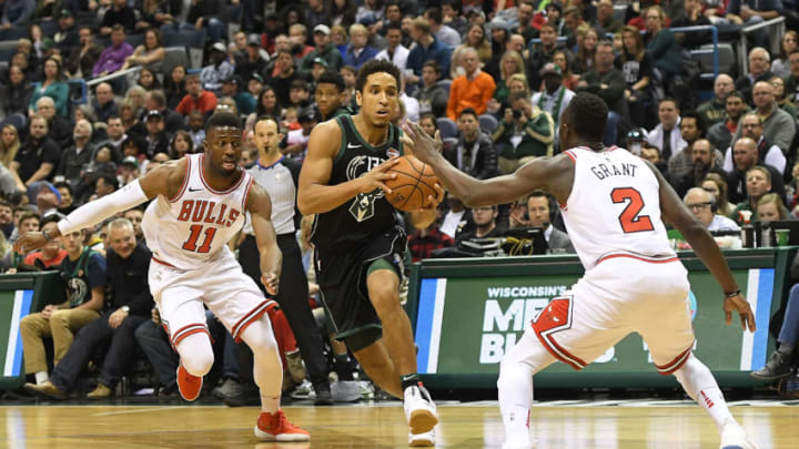 MILWAUKEE, WI - DECEMBER 15: Malcolm Brogdon #13 of the Milwaukee Bucks drives between David Nwaba #11 and Jerian Grant #2 of the Chicago Bulls during a game at the Bradley Center on December 15, 2017 in Milwaukee, Wisconsin. NOTE TO USER: User expressly acknowledges and agrees that, by downloading and or using this photograph, User is consenting to the terms and conditions of the Getty Images License Agreement. (Photo by Stacy Revere/Getty Images)