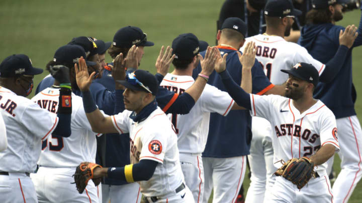 LOS ANGELES, CALIFORNIA - OCTOBER 08: Jose Altuve #27 of the Houston Astros celebrates a series win against the Oakland Athletics in Game Four of the American League Division Series at Dodger Stadium on October 08, 2020 in Los Angeles, California. (Photo by Harry How/Getty Images)