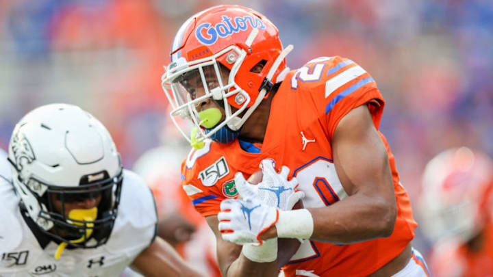 GAINESVILLE, FLORIDA - SEPTEMBER 28: Malik Davis #20 of the Florida Gators runs for yardage during the fourth quarter against the Towson Tigers at Ben Hill Griffin Stadium on September 28, 2019 in Gainesville, Florida. (Photo by James Gilbert/Getty Images)