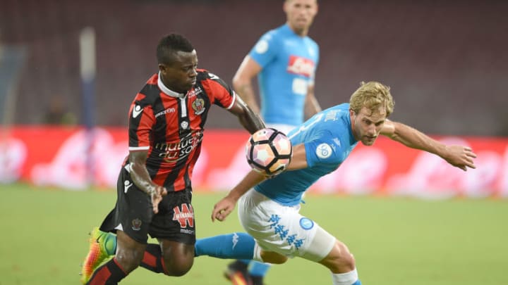 NAPLES, ITALY - AUGUST 01: Napoli's player Ivan Strinic vies with OGC Nice player Jean Seri during the pre-season friendly match between SSC Napoli and OGC Nice at Stadio San Paolo on August 1, 2016 in Naples, Italy. (Photo by Francesco Pecoraro/Getty Images)