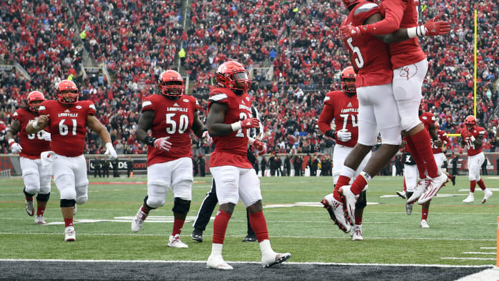 Nov 26, 2016; Louisville, KY, USA; Louisville Cardinals wide receiver Seth Dawkins (5) celebrates with wide receiver Reggie Bonnafon (7) after scoring a touchdown against the Kentucky Wildcats during the second quarter at Papa John’s Cardinal Stadium. Mandatory Credit: Jamie Rhodes-USA TODAY Sports