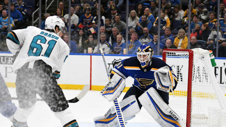 ST. LOUIS, MO - NOVEMBER 09: St. Louis Blues goalie Chad Johnson (31) blocks a shot by San Jose Sharks defenseman Justin Braun (61) during a NHL game game between the San Jose Sharks and the St. Louis Blues on November 9, 2018, at Enterprise Center, St. Louis, MO. (Photo by Keith Gillett/Icon Sportswire via Getty Images)