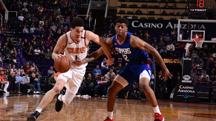 PHOENIX, AZ – FEBRUARY 23: Devin Booker #1 of the Phoenix Suns handles the ball during the game against the LA Clippers on February 23, 2018 at Talking Stick Resort Arena in Phoenix, Arizona. NOTE TO USER: User expressly acknowledges and agrees that, by downloading and or using this photograph, user is consenting to the terms and conditions of the Getty Images License Agreement. Mandatory Copyright Notice: Copyright 2018 NBAE (Photo by Michael Gonzales/NBAE via Getty Images)