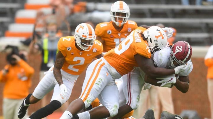 Tennessee defensive lineman Kurott Garland (79) tackles Alabama running back Najee Harris (22) during a game between Alabama and Tennessee at Neyland Stadium in Knoxville, Tenn. on Saturday, Oct. 24, 2020.102420 Ut Bama Gameaction