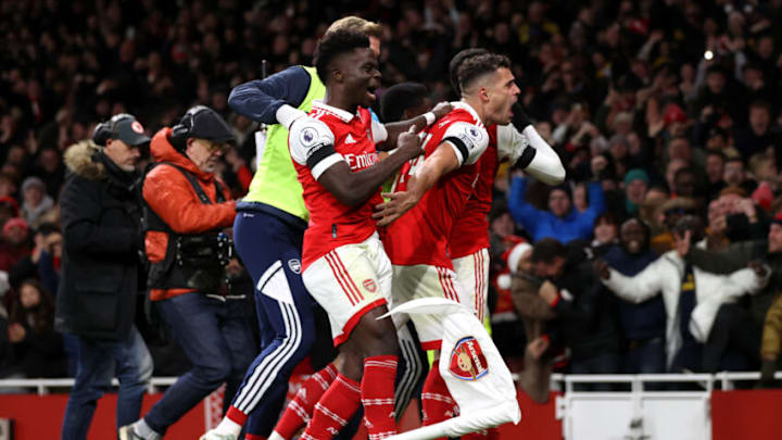 LONDON, ENGLAND - DECEMBER 26: Gabriel Martinelli of Arsenal celebrates with teammates Bukayo Saka and Granit Xhaka after scoring their side's second goal during the Premier League match between Arsenal FC and West Ham United at Emirates Stadium on December 26, 2022 in London, England. (Photo by Alex Pantling/Getty Images)