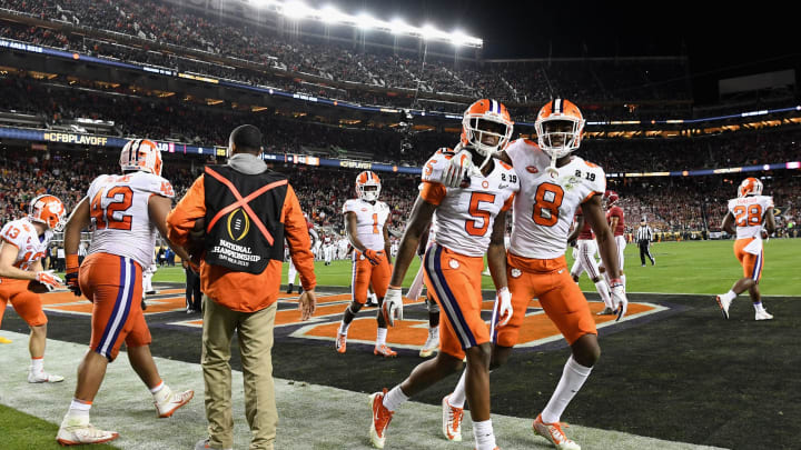 SANTA CLARA, CA – JANUARY 07: Tee Higgins #5 of the Clemson Tigers is congratulated by his teammates after his third quarter touchdown reception against the Alabama Crimson Tide in the CFP National Championship presented by AT&T at Levi’s Stadium on January 7, 2019 in Santa Clara, California. (Photo by Thearon W. Henderson/Getty Images)