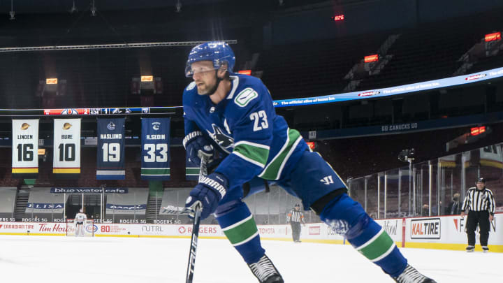 VANCOUVER, BC – MAY 03: Alex Edler #23 of the Vancouver Canucks skates with the puck during NHL action. (Photo by Rich Lam/Getty Images)