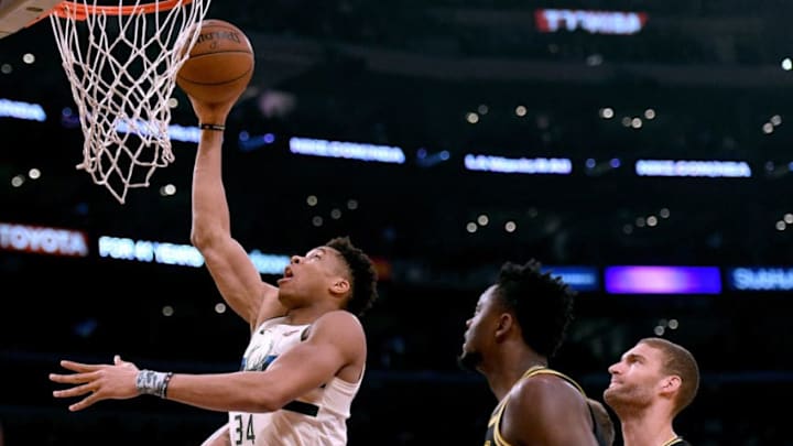 LOS ANGELES, CA - MARCH 30: Giannis Antetokounmpo #34 of the Milwaukee Bucks scores in front of Julius Randle #30 and Brook Lopez #11 of the Los Angeles Lakers during the first half at Staples Center on March 30, 2018 in Los Angeles, California. (Photo by Harry How/Getty Images)