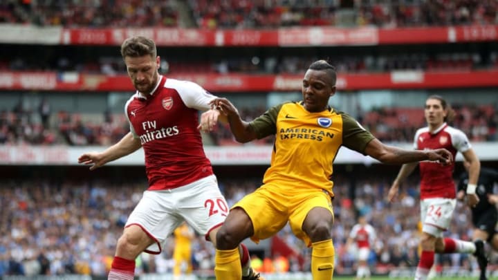 LONDON, ENGLAND - OCTOBER 01: Shkodran Mustafi of Arsenal and Jose Izquierdo of Brighton and Hove Albion battle for possession during the Premier League match between Arsenal and Brighton and Hove Albion at Emirates Stadium on October 1, 2017 in London, England. (Photo by Julian Finney/Getty Images)