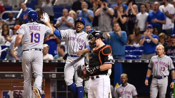 Sep 27, 2016; Miami, FL, USA; New York Mets right fielder Jay Bruce (left) celebrates at home plate with Mets center fielder Curtis Granderson (center) after driving in Granderson on a two run homer during the second inning against Miami Marlins at Marlins Park. Mandatory Credit: Steve Mitchell-USA TODAY Sports