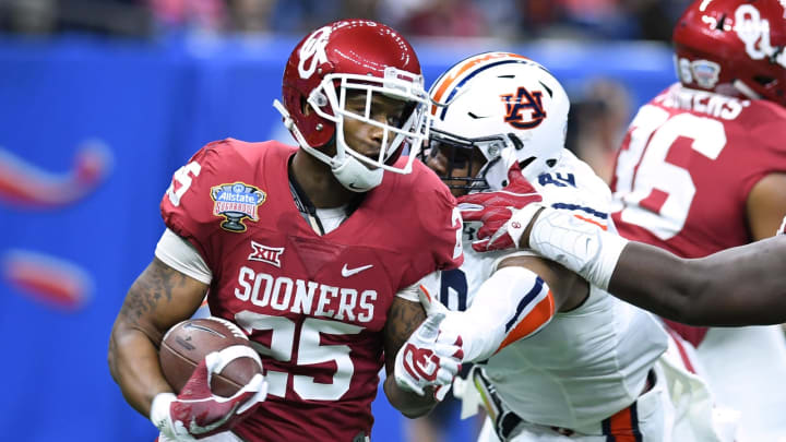 New Orleans , LA, USA; Oklahoma Sooners running back Joe Mixon (25) runs the ball against Auburn Tigers linebacker Darrell Williams (49) in the first quarter of the 2017 Sugar Bowl at the Mercedes-Benz Superdome. Mandatory Credit: John David Mercer-USA TODAY Sports