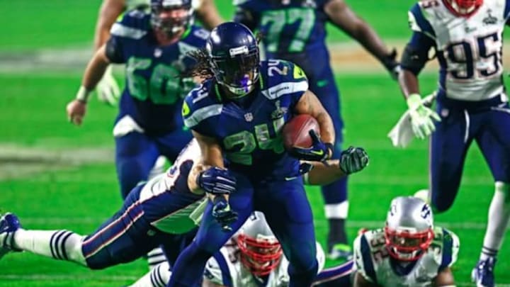 Feb 1, 2015; Glendale, AZ, USA; Seattle Seahawks running back Marshawn Lynch (24) runs the ball in Super Bowl XLIX against the New England Patriots at University of Phoenix Stadium. Mandatory Credit: Andrew Weber-USA TODAY Sports