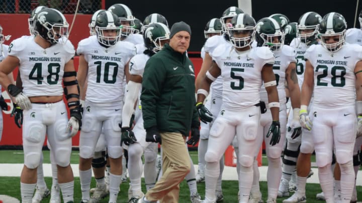 LINCOLN, NE - NOVEMBER 17: Head coach Mark Dantonio of the Michigan State Spartans walks on the field with the team before the game against the Nebraska Cornhuskers at Memorial Stadium on November 17, 2018 in Lincoln, Nebraska. (Photo by Steven Branscombe/Getty Images)