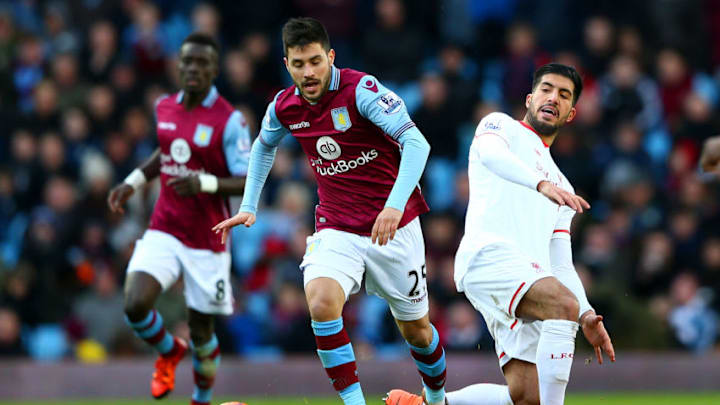 BIRMINGHAM, ENGLAND - FEBRUARY 14: Carles Gil of Aston Villa battles for the ball with Emre Can of Liverpool during the Barclays Premier League match between Aston Villa and Liverpool at Villa Park on February 14, 2016 in Birmingham, England. (Photo by Michael Steele/Getty Images)