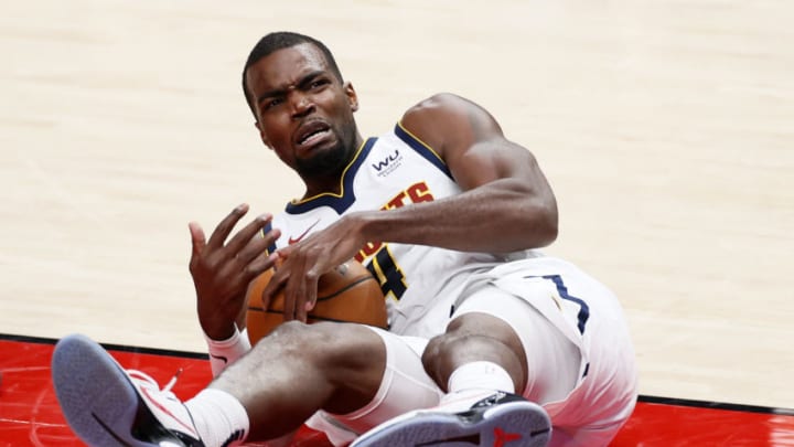 Paul Millsap, Denver Nuggets gathers a loose ball against the Portland Trail Blazers in the NBA Playoffs. (Photo by Steph Chambers/Getty Images)