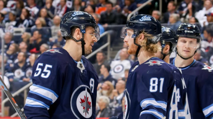 WINNIPEG, MB - OCTOBER 16: Mark Scheifele #55 and Kyle Connor #81 of the Winnipeg Jets discuss strategy during a third period stoppage in play against the Edmonton Oilers at the Bell MTS Place on October 16, 2018 in Winnipeg, Manitoba, Canada. The Oilers defeated the Jets 5-4 in overtime. (Photo by Jonathan Kozub/NHLI via Getty Images)