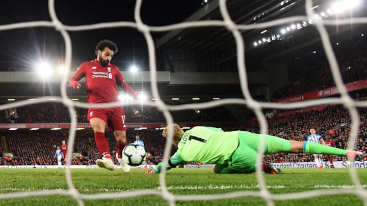 LIVERPOOL, ENGLAND - APRIL 26: Mohamed Salah of Liverpool (11) scores his team's fifth goal past Jonas Lossl of Huddersfield Town during the Premier League match between Liverpool FC and Huddersfield Town at Anfield on April 26, 2019 in Liverpool, United Kingdom. (Photo by Michael Regan/Getty Images)
