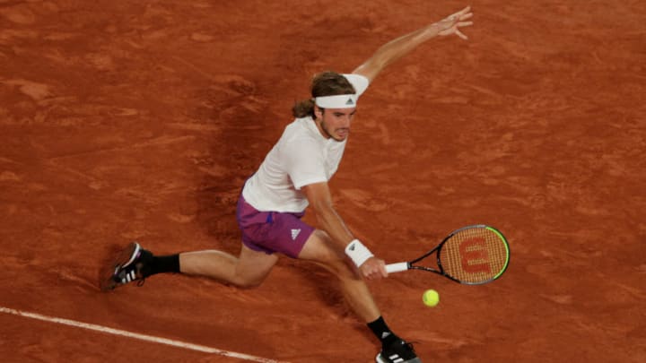 PARIS, FRANCE - JUNE 04: Stefanos Tsitsipas of Greece plays a backhand during his men's singles third round match against John Isner of USA on during day six of the 2021 French Open at Roland Garros on June 04, 2021 in Paris, France. (Photo by Adam Pretty/Getty Images)
