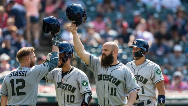 CLEVELAND, OH - MAY 27: Max Stassi #12, Yuli Gurriel #10, Evan Gattis #11 and Carlos Correa #1 of the Houston Astros celebrate after Gattis' three-run home run during the eighth inning against the Cleveland Indians at Progressive Field on May 27, 2018 in Cleveland, Ohio. (Photo by Jason Miller/Getty Images)