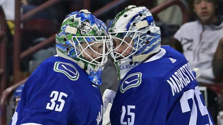 VANCOUVER, BC - MARCH 9: Thatcher Demko #35 of the Vancouver Canucks is switch out with teammate Jacob Markstrom #25 during their NHL game against the Vegas Golden Knights at Rogers Arena March 9, 2019 in Vancouver, British Columbia, Canada. (Photo by Jeff Vinnick/NHLI via Getty Images)