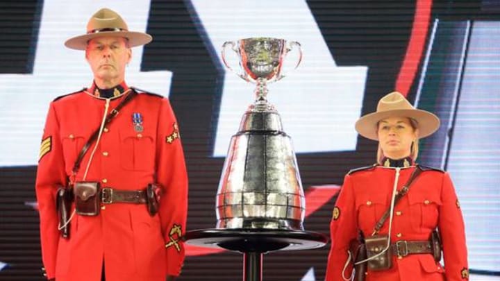TORONTO, ON – NOVEMBER 27: Canadian Mounties guard the Grey Cup following the final whistle of the 104th Grey Cup Championship Game between the Ottawa Redblacks and the Calgary Stampeders at BMO Field on November 27, 2016 in Toronto, Canada. (Photo by Vaughn Ridley/Getty Images)