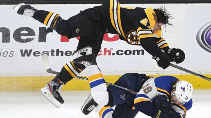 BOSTON, MASSACHUSETTS - MAY 27: Torey Krug #47 of the Boston Bruins checks Robert Thomas #18 of the St. Louis Blues during the third period in Game One of the 2019 NHL Stanley Cup Final at TD Garden on May 27, 2019 in Boston, Massachusetts. (Photo by Patrick Smith/Getty Images)