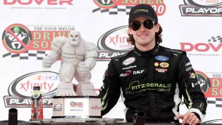 DOVER, DE - SEPTEMBER 30: Ryan Blaney, driver of the #22 Fitzgerald Ford, poses with the trophy in Victory Lane after winning the NASCAR XFINITY Series "Use Your Melon. Drive Sober 200" at Dover International Speedway on September 30, 2017 in Dover, Delaware. (Photo by Brian Lawdermilk/Getty Images)