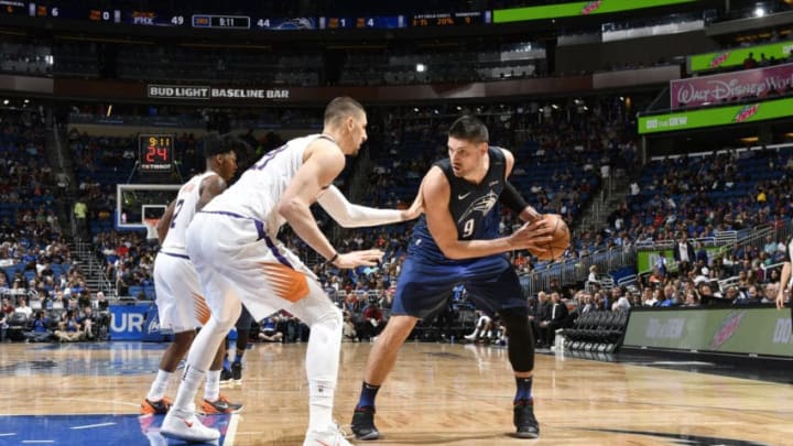 ORLANDO, FL - MARCH 24: Nikola Vucevic #9 of the Orlando Magic handles the ball against the Phoenix Suns on March 24, 2018 at Amway Center in Orlando, Florida. NOTE TO USER: User expressly acknowledges and agrees that, by downloading and/or using this photograph, user is consenting to the terms and conditions of the Getty Images License Agreement. Mandatory Copyright Notice: Copyright 2018 NBAE (Photo by Fernando Medina/NBAE via Getty Images)