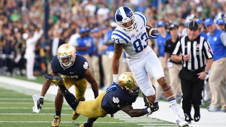 SOUTH BEND, IN - SEPTEMBER 24: Anthony Nash #83 of the Duke Blue Devils is tripped up by Daelin Hayes #9 of the Notre Dame Fighting Irish during the second half of a game at Notre Dame Stadium on September 24, 2016 in South Bend, Indiana. Duke defeated Notre Dame 38-35. (Photo by Stacy Revere/Getty Images)