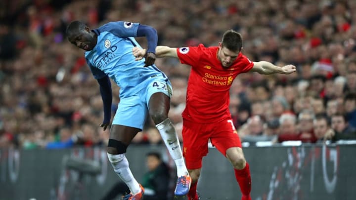 LIVERPOOL, ENGLAND - DECEMBER 31: James Milner of Liverpool and Yaya Toure of Manchester City during the Premier League match between Liverpool and Manchester City at Anfield on December 31, 2016 in Liverpool, England. (Photo by Clive Brunskill/Getty Images)