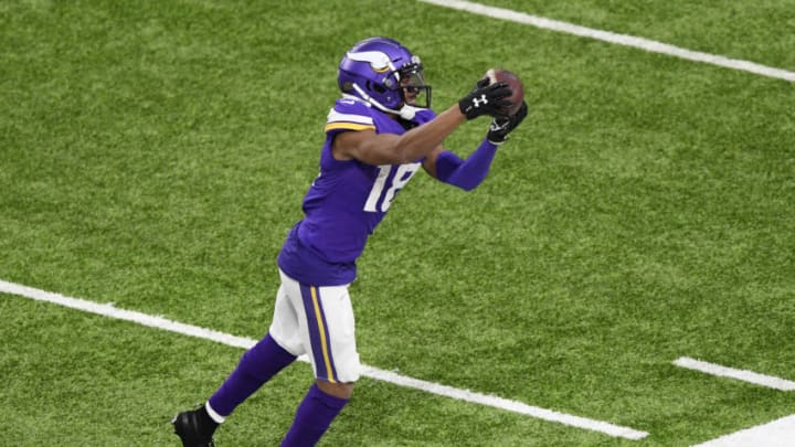 MINNEAPOLIS, MINNESOTA - DECEMBER 20: Justin Jefferson #18 of the Minnesota Vikings makes a reception along the sideline during the fourth quarter against the Chicago Bears at U.S. Bank Stadium on December 20, 2020 in Minneapolis, Minnesota. (Photo by Hannah Foslien/Getty Images)