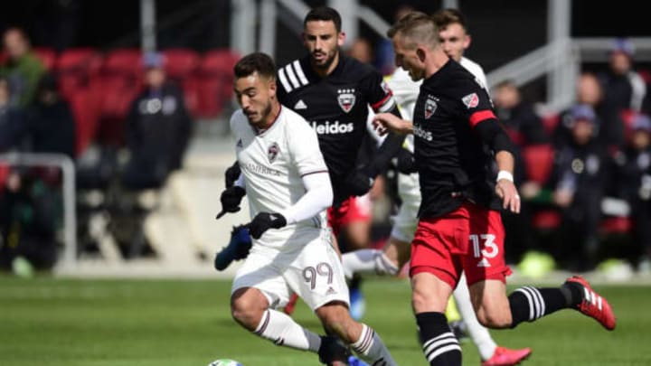 WASHINGTON, DC – FEBRUARY 29: Andre Shinyashiki #99 of Colorado Rapids dribbles the ball against Frederic Brillant #13 of D.C. United in the first half at Audi Field on February 29, 2020, in Washington, DC. (Photo by Patrick McDermott/Getty Images)