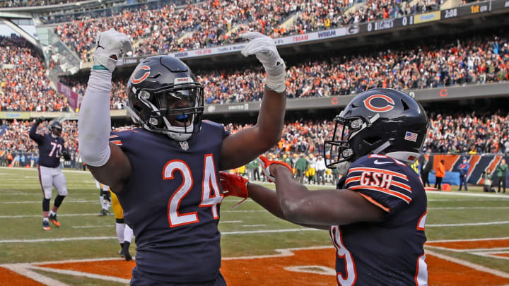 CHICAGO, IL – DECEMBER 16: Jordan Howard #24 and Tarik Cohen #29 of the Chicago Bears celebrate after Howard scored a touchdown in the first quarter against the Green Bay Packers with at Soldier Field on December 16, 2018 in Chicago, Illinois. (Photo by Jonathan Daniel/Getty Images)