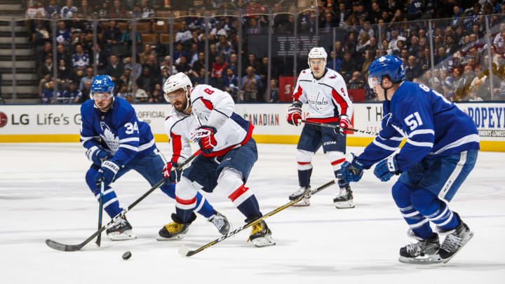 TORONTO, ON – FEBRUARY 21: Alex Ovechkin #8 of the Washington Capitals battles with Auston Matthews #34 and Jake Gardiner #51 of the Toronto Maple Leafs during the second period at the Scotiabank Arena on February 21, 2019 in Toronto, Ontario, Canada. (Photo by Mark Blinch/NHLI via Getty Images)