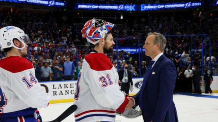 TAMPA, FLORIDA – JULY 07: Carey Price #31 of the Montreal Canadiens and head coach Jon Cooper of the Tampa Bay Lightning shake hands following the Lightning’s 1-0 victory in Game Five to win the 2021 NHL Stanley Cup Final at Amalie Arena on July 07, 2021 in Tampa, Florida. (Photo by Bruce Bennett/Getty Images)