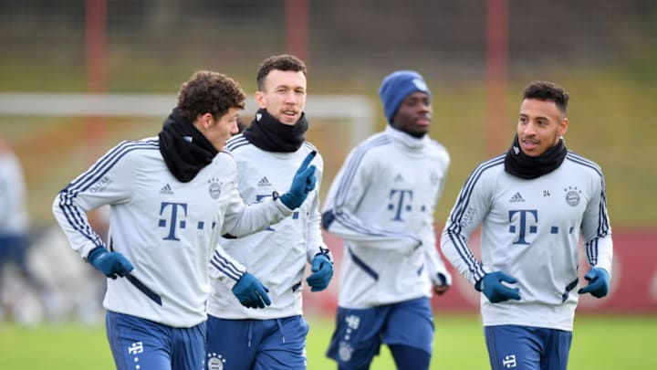 MUNICH, GERMANY – DECEMBER 16: (EXCLUSIVE COVERAGE) Benjamin Pavard, Ivan Perisic and Corentin Tolisso of Bayern Muenchen talk during a training session at Saebener Strasse training ground on December 16, 2019 in Munich, Germany. (Photo by S. Widmann/Getty Images for FC Bayern)