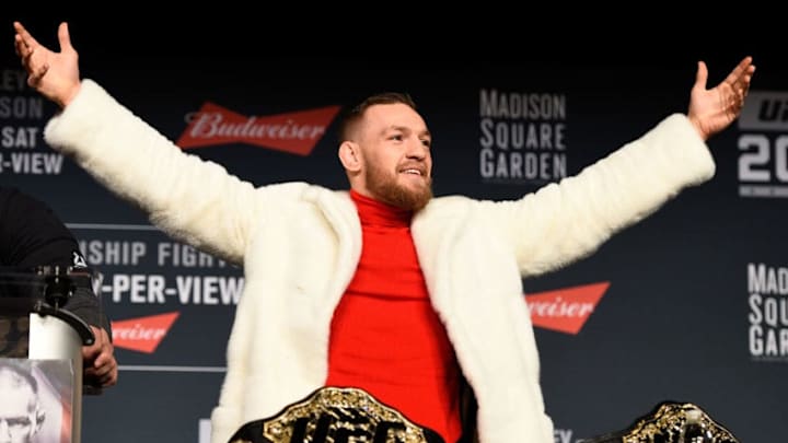 NEW YORK, NY - NOVEMBER 10: UFC featherweight champion Conor McGregor of Ireland takes the belt of lightweight champion Eddie Alvarez (not pictured) during the UFC 205 press conference inside The Theater at Madison Square Garden on November 10, 2016 in New York City. (Photo by Jeff Bottari/Zuffa LLC/Zuffa LLC via Getty Images)
