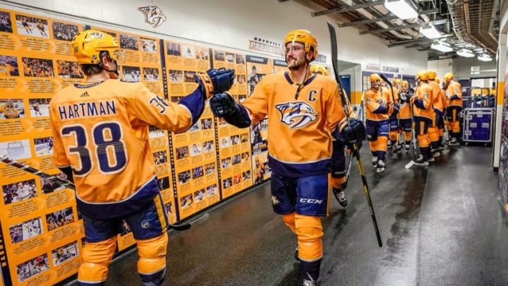 NASHVILLE, TN - JANUARY 19: Roman Josi #59 and Ryan Hartman #38 of the Nashville Predators prepare to take the ice against the Florida Panthers at Bridgestone Arena on January 19, 2019 in Nashville, Tennessee. (Photo by John Russell/NHLI via Getty Images)