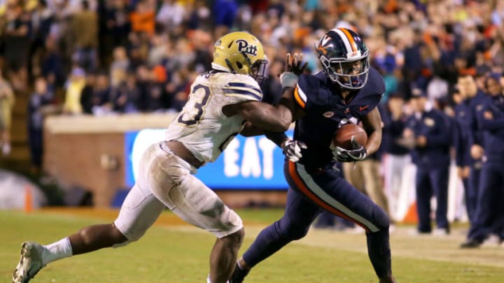 CHARLOTTESVILLE, VA - NOVEMBER 02: Oluwaseun Idowu #23 of the Pittsburgh Panthers tackles Hasise Dubois #8 of the Virginia Cavaliers in the second half during a game at Scott Stadium on November 2, 2018 in Charlottesville, Virginia. (Photo by Ryan M. Kelly/Getty Images)