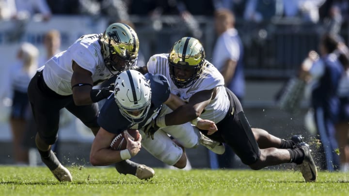 STATE COLLEGE, PA – OCTOBER 05: Sean Clifford #14 of the Penn State Nittany Lions is tackled by Jalen Graham #6 of the Purdue Boilermakers during the second half at Beaver Stadium on October 5, 2019 in State College, Pennsylvania. (Photo by Scott Taetsch/Getty Images)