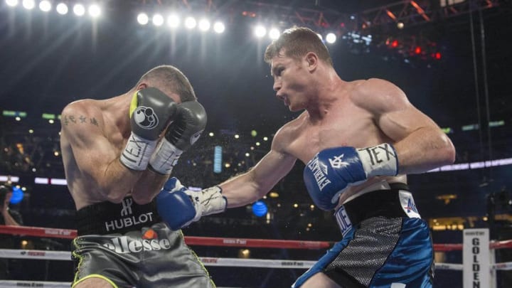 Sep 17, 2016; Arlington, TX, USA; Canelo Alvarez (blue trunks) fights Liam Smith (grey trunks) during the WBO middleweight boxing world championship bout at AT&T Stadium. Mandatory Credit: Jerome Miron-USA TODAY Sports