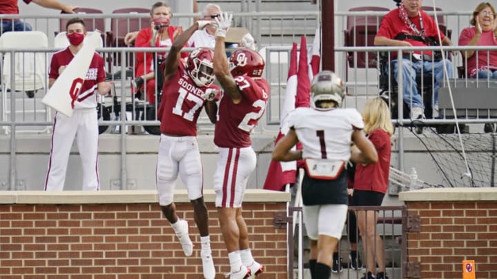 NORMAN, OK - SEPTEMBER 12: Oklahoma wide receiver Marvin Mims #17 celebrates his touchdown with teammate Jeremiah Hall #27 in front of Missouri State cornerback Zack Sanders #1 in the first half of an NCAA college football game on September 12, 2020, in Norman, Oklahoma. (Photo by Sue Ogrocki-Pool/Getty Images)