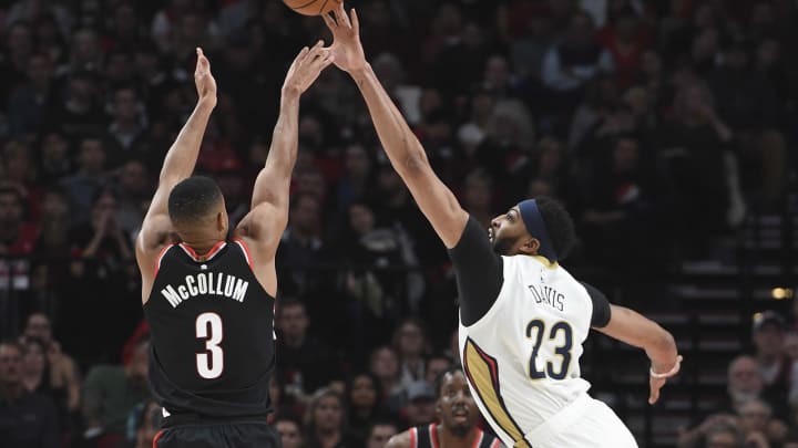 PORTLAND, OR – OCTOBER 24: Anthony Davis #23 of the New Orleans Pelicans blocks the shot of CJ McCollum #3 of the Portland Trail Blazers during the first quarter of the game at Moda Center on October 24, 2017 in Portland, Oregon. NOTE TO USER: User expressly acknowledges and agrees that, by downloading and or using this photograph, User is consenting to the terms and conditions of the Getty Images License Agreement. (Photo by Steve Dykes/Getty Images)