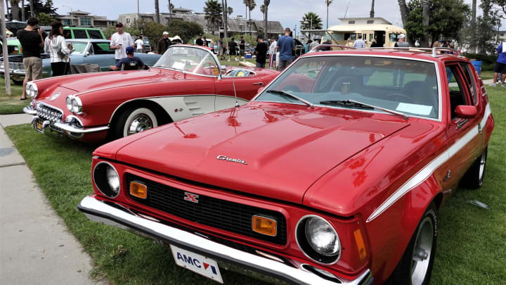 Side by side in red and white, an AMC Gremlin X and a Chevrolet Corvette brightened the Father’s Day car show at Channel Islands Harbor Sunday afternoon.Car show Grem And Corvette