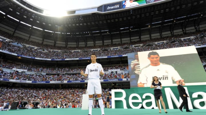 Real Madrid's new player Portuguese Cristiano Ronaldo gives the thumbs up during his official presentation at the Santiago Bernabeu stadium in Madrid on July 6, 2009. Real acquired the 24-year-old Portuguese striker from Manchester United last month on a six-year deal worth 94 million euros (131 million dollars) and Spanish media reports that he will be paid 13 million euros each season. AFP PHOTO / DANI POZO (Photo credit should read Dani Pozo/AFP via Getty Images)