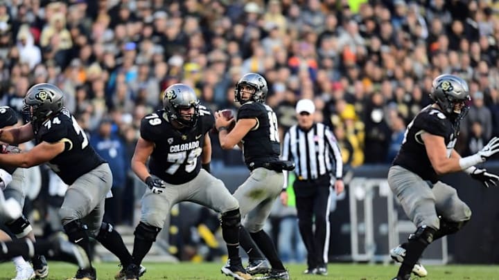 Nov 19, 2016; Boulder, CO, USA; Colorado Buffaloes quarterback Sefo Liufau (13) prepares to pass the ball in the second half against the Washington State Cougars at Folsom Field. The Buffaloes defeated the Cougars 38-24. Mandatory Credit: Ron Chenoy-USA TODAY Sports