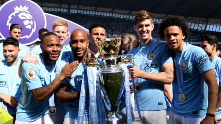 MANCHESTER, ENGLAND – MAY 06: Raheem Sterling of Manchester City, Kevin De Bruyne of Manchester City, Fabian Delph of Manchester City, Kyle Walker of Manchester City, John Stones of Manchester City and Leroy Sane of Manchester City celebrate with The Premier League Trophy after the Premier League match between Manchester City and Huddersfield Town at Etihad Stadium on May 6, 2018 in Manchester, England. (Photo by Michael Regan/Getty Images)