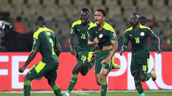 Senegal's defender Abdou Diallo (2ndR) celebrates after scoring his team's first goal during the Africa Cup of Nations (CAN) 2021 semi final football match between Burkina Faso and Senegal at Stade Ahmadou-Ahidjo in Yaounde on February 2, 2022. (Photo by CHARLY TRIBALLEAU/AFP via Getty Images)